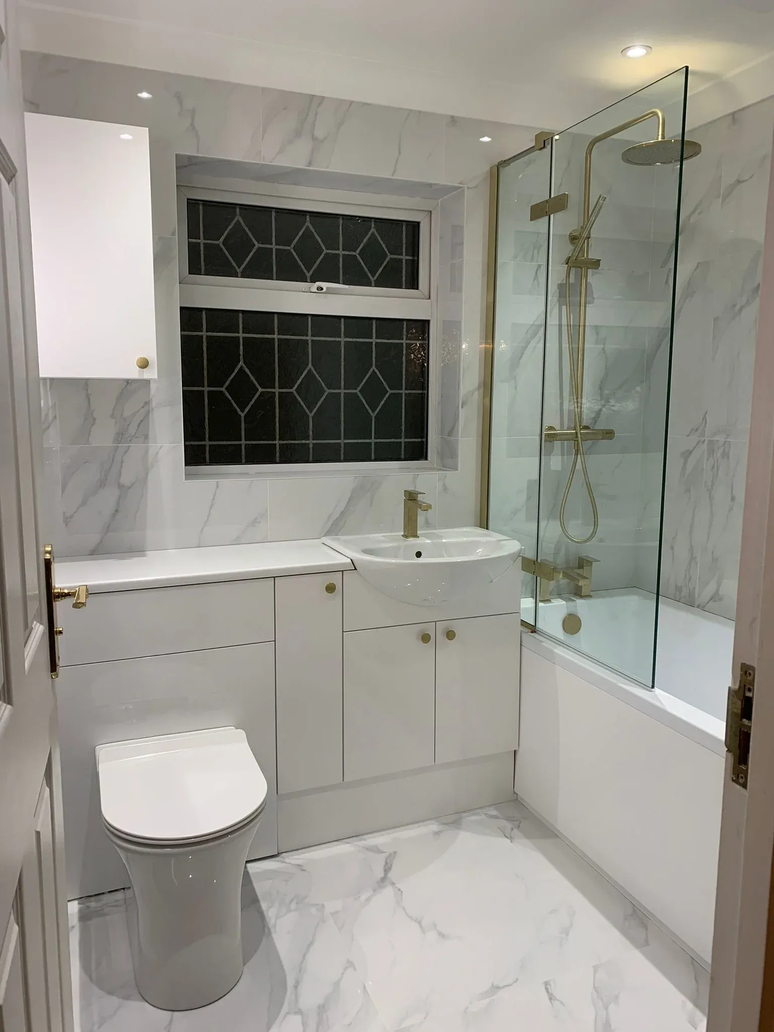 New bathroom installation in Essex with bath, shower and vanity
